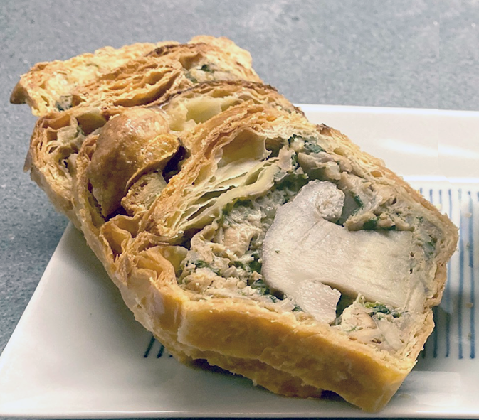 pie of whole cep caps in mushroom pate baked in a pastry crust