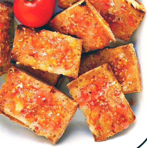 Catalan pa amb tomaquet, toasted bread rubbed with garlic and tomato
