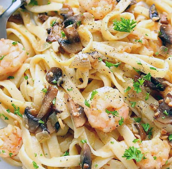sauce of prawns, scallops and horn of plenty mushrooms served on a bed of linguine pasta