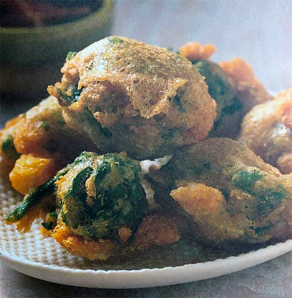 meadow puffball mushrooms covered in wilted lettuce and fried in tempura batter