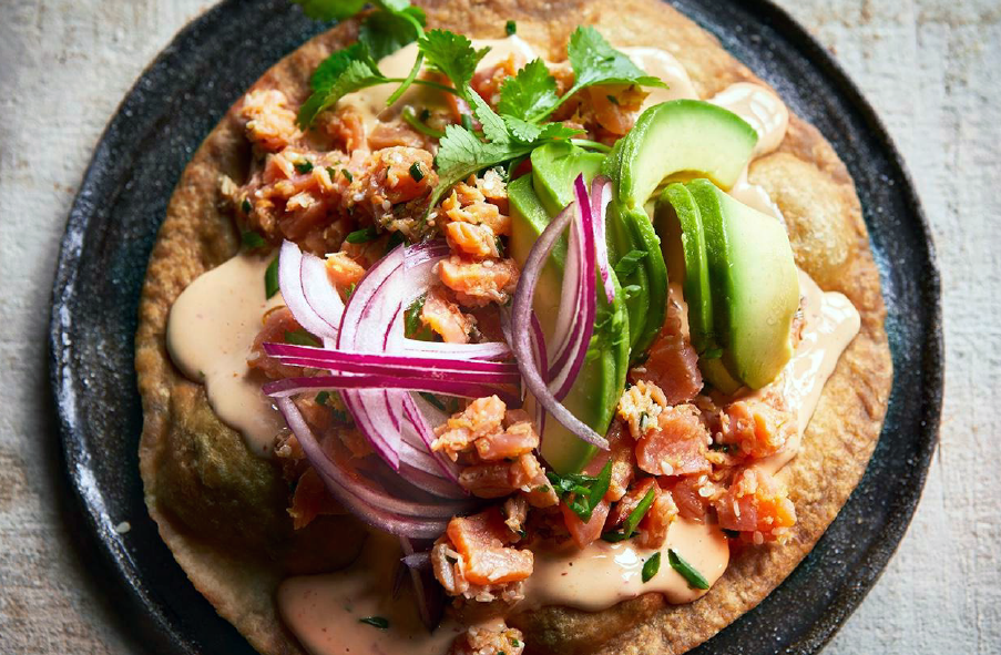 salmon tostada served on a plate