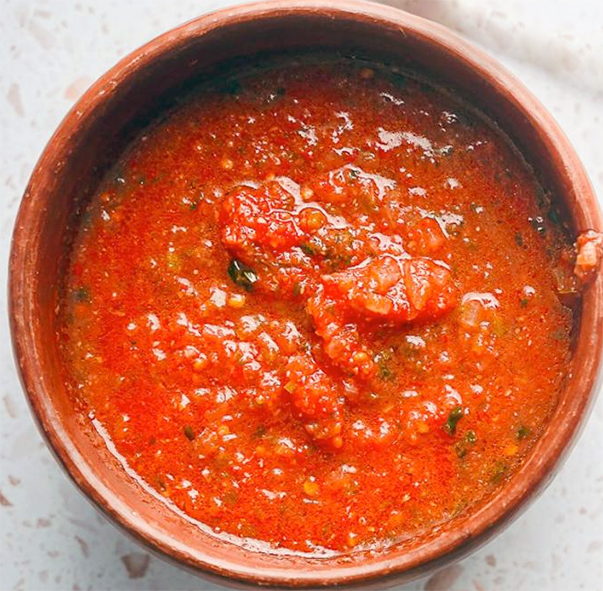 salsa roja in an earthenware bowl