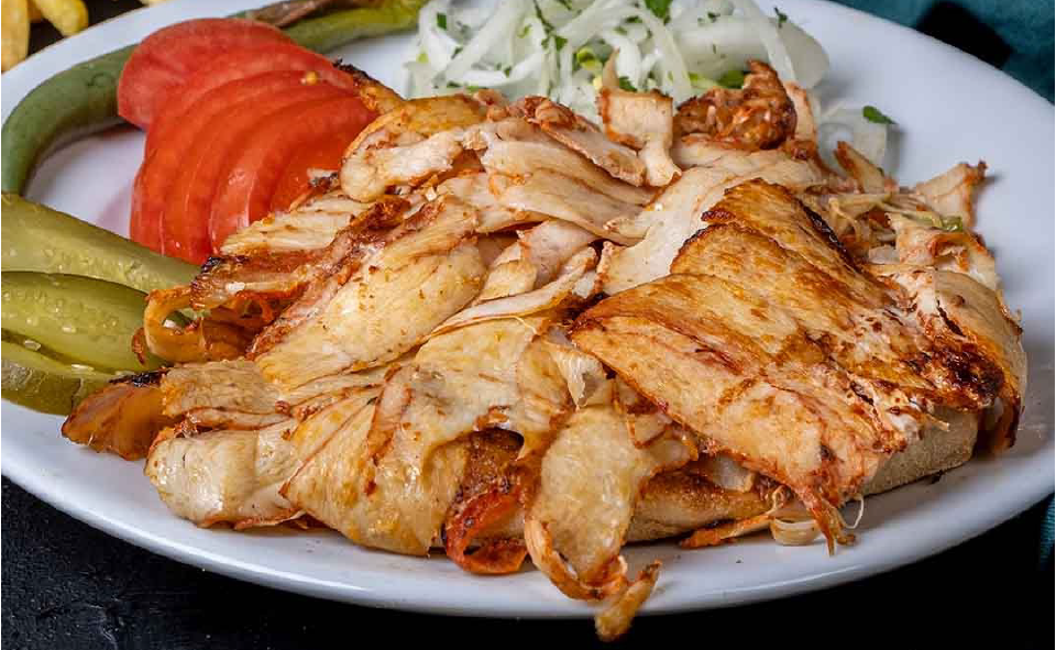 Turkish chicken doner meat served on a plate with salad