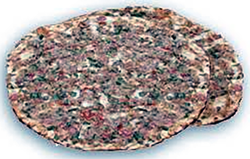 Two Turkish Cypriot lahmacun pizzas stacked on top of each other