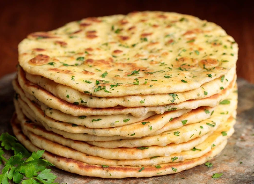 Thick bazlama, Turkish leavened flatbread stacked on a granite work surface