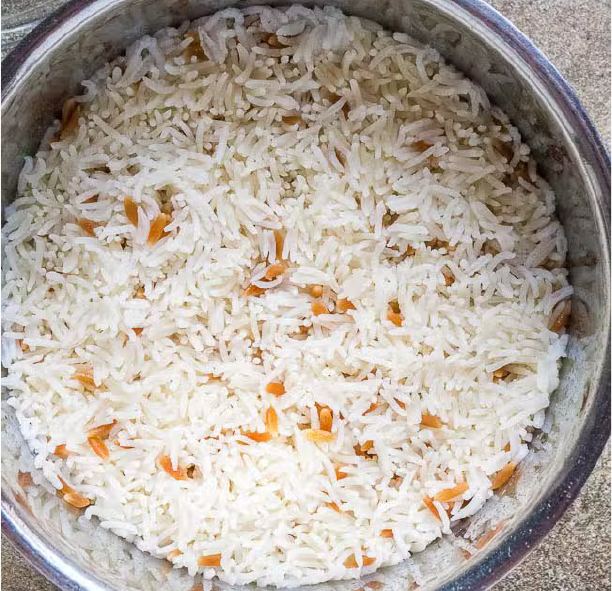 Turkish-style rice with fried orzo pasta in a steel bowl