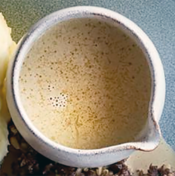 pwhisky cream sauce served in a handle-less jug