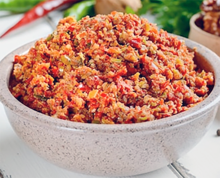 Abkhazian adjika paprika sauce mounded in an earthenware bowl