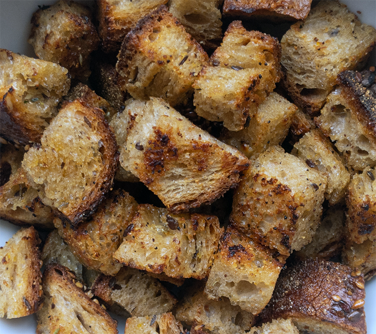fried cubes of bread in a bowl