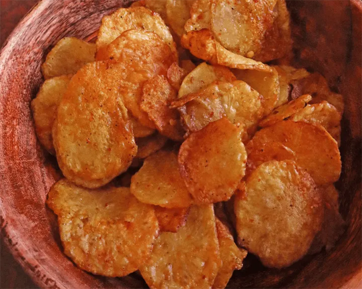 crisp potato chips served in an earthenware bowl