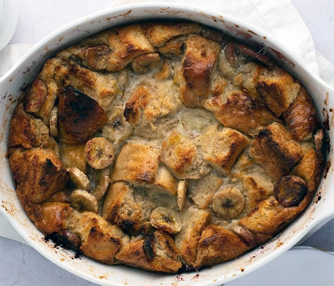 Ugandan-style banana bread pudding in a white baking dish