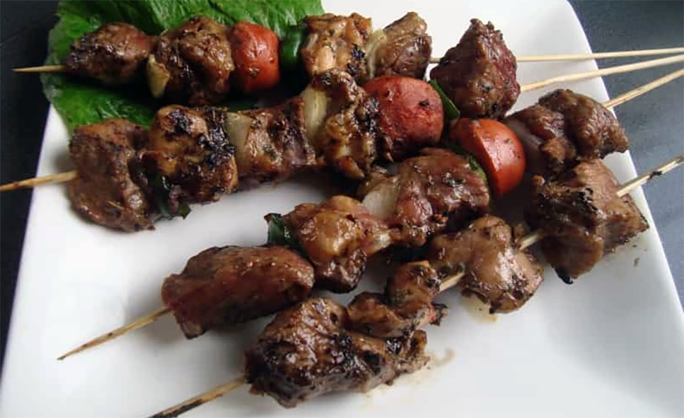 Mexican spicy kebabs on a white plate