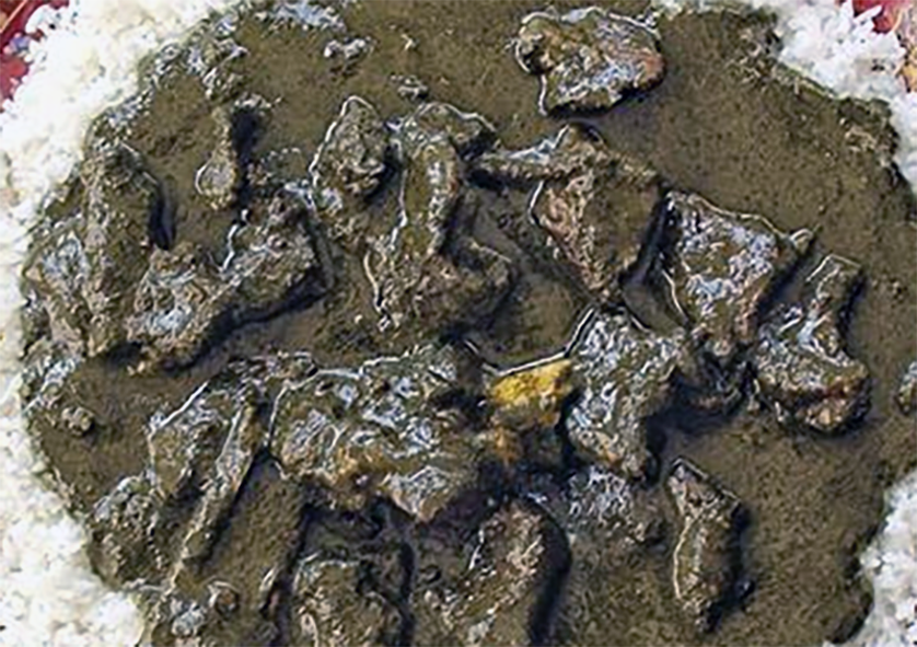 barokhe, stew of beef and fish in a cassava leaf and peanut butter base served on a bed of rice