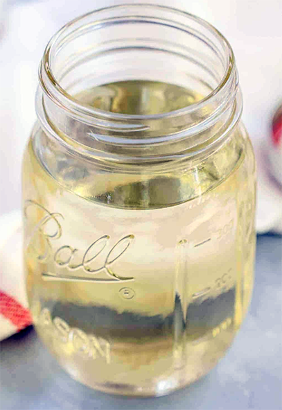 simple syrup in a glass jam jar