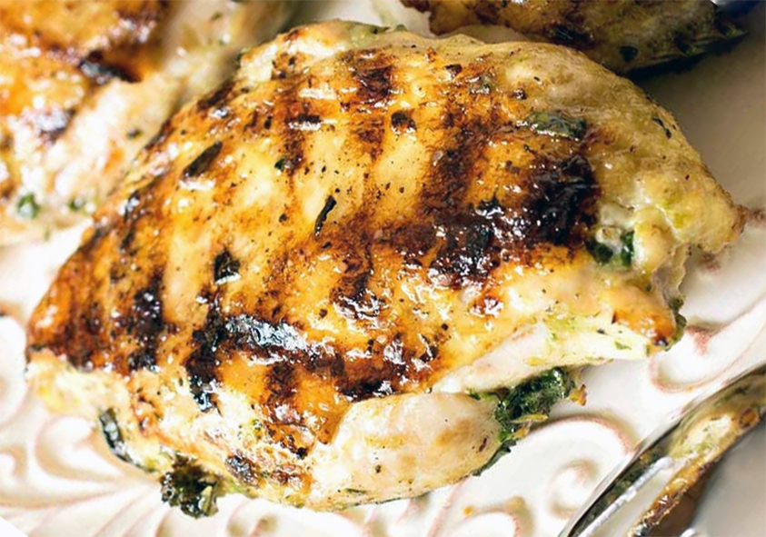basil-grilled chicken breast on a trivet