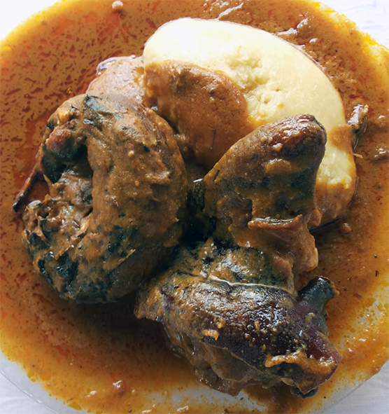 beef in ground egusi seed sauce served with fufu