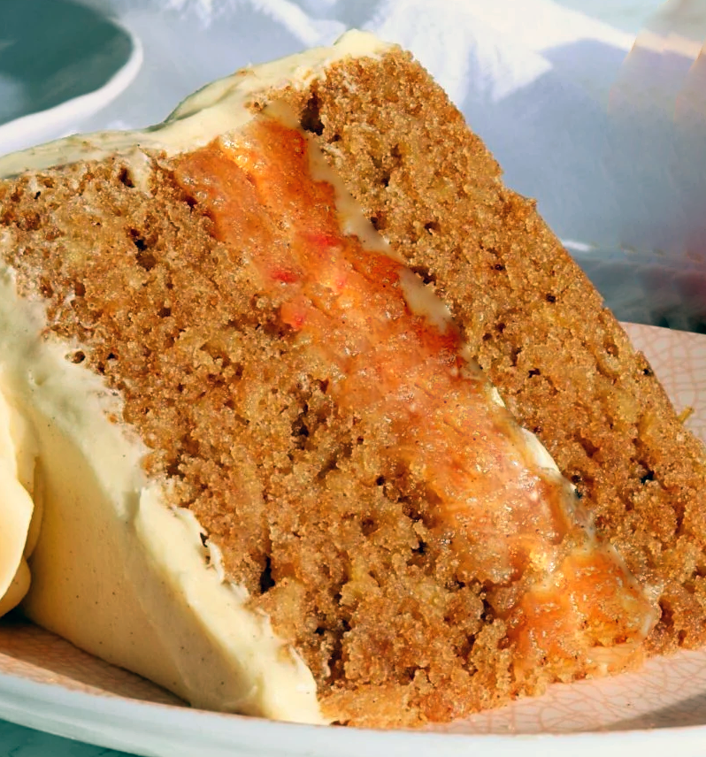 slice of ginger layer cake with apple filling on a plate