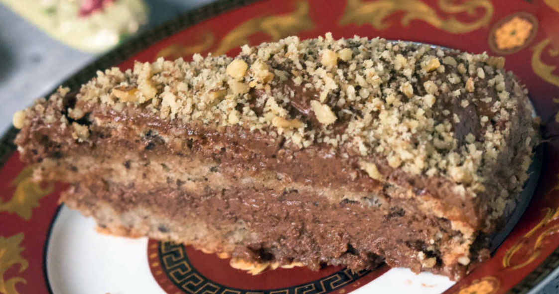 slice of Croatian chocolate walnut cake served on a plate