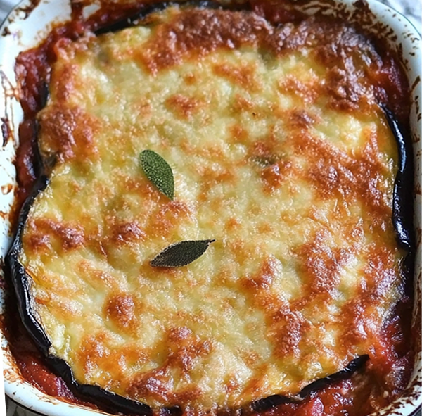 brinjal, tomato and ricotta cheese casserole in a baking dish