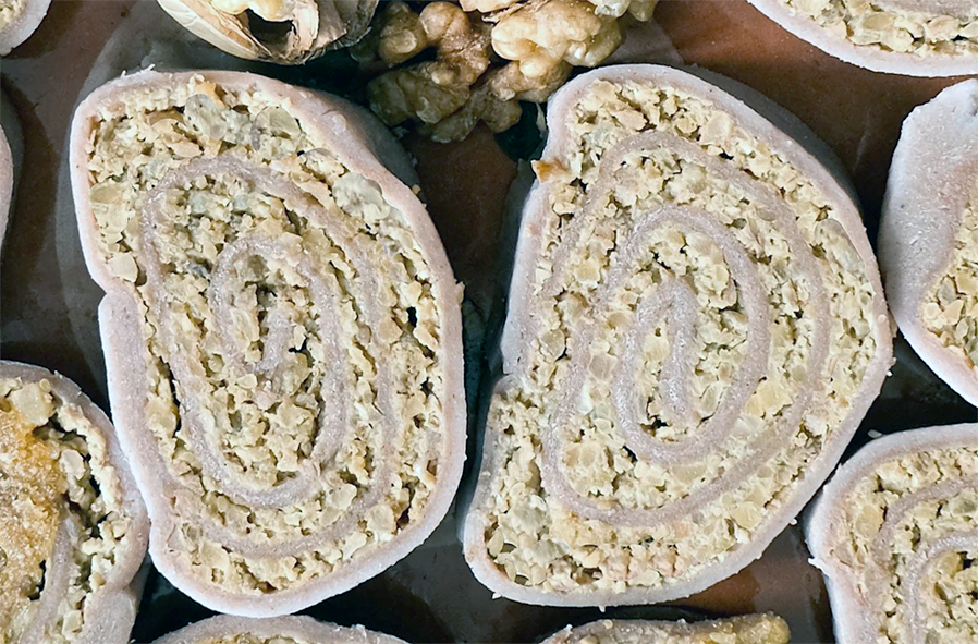 two slices of buckwheat struklji with walnut filling