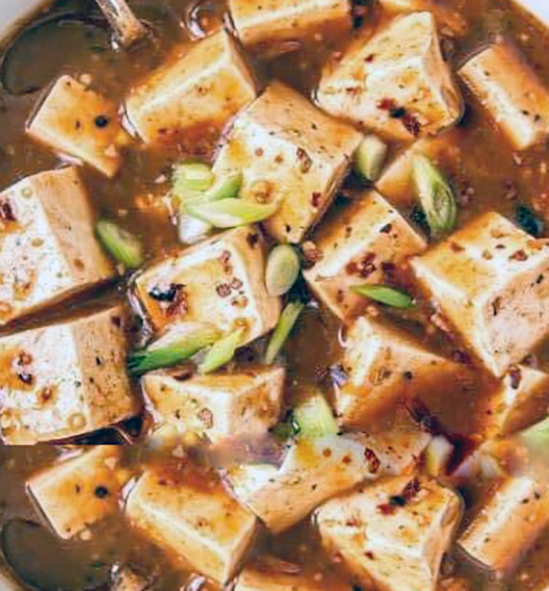 tofu gumbo in a white-walled Dutch oven