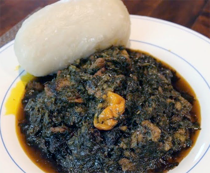 beef stew with peanut, tomato, onion, okra and chilli served with a roll of fufu