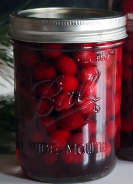 Preserved cranberries in a canning jar