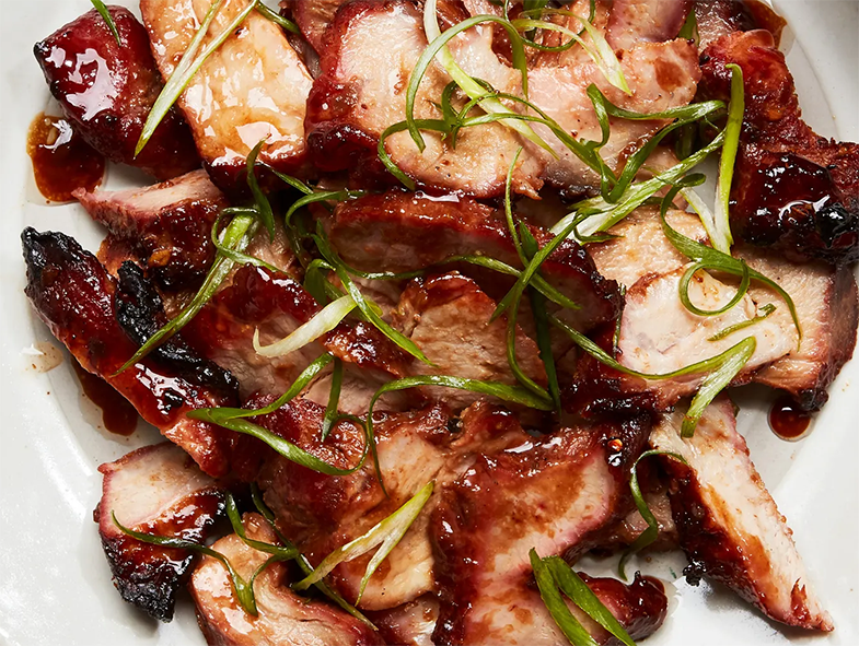 Cantonese pork pieces served on a white plate