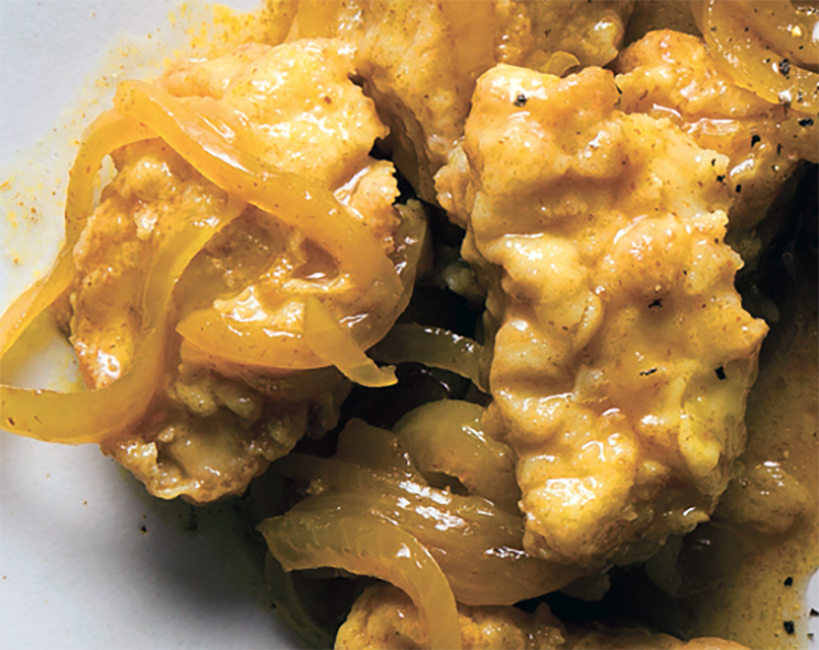Cape Malay pickled fish pieces arranged on a plate
