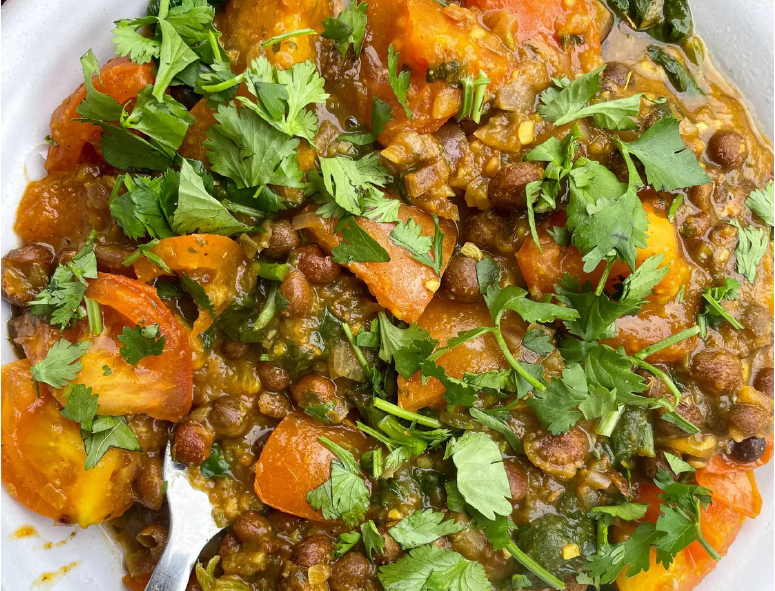 curry of carlin peas and tomatoes topped with coriander leaves