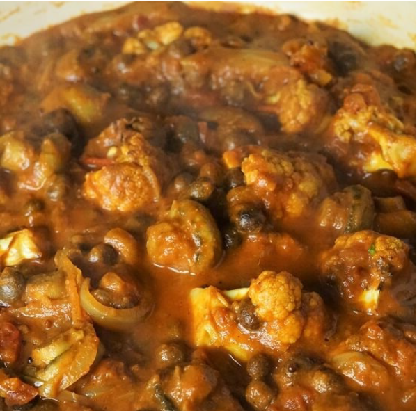 curry of roasted cauliflower and mushrooms with carlin peas in a tomato and coconut milk gravy