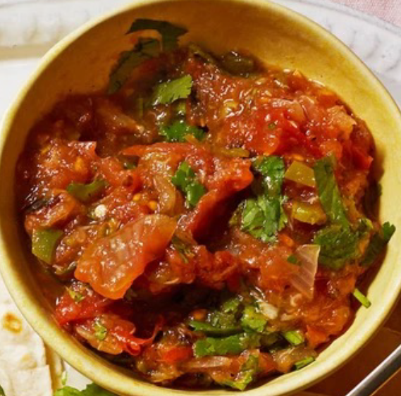 charred spicy salsa presented in a yellow bowl