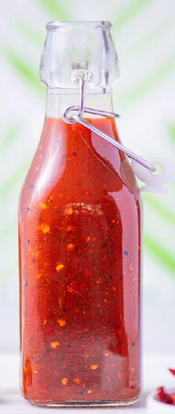 chile japones salsa in a flip-top glass bottle