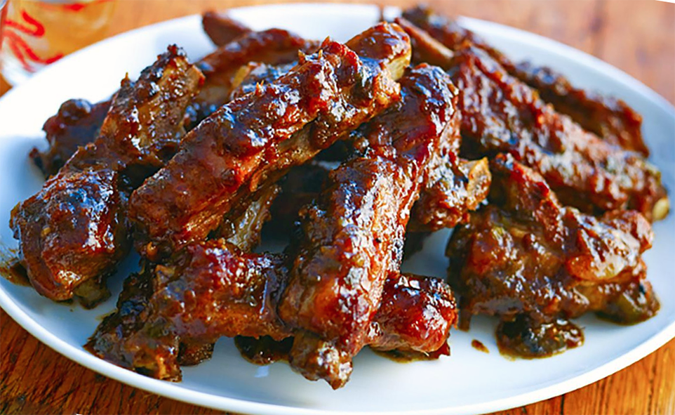 chinese five-spice spare ribs served piled on a white plate
