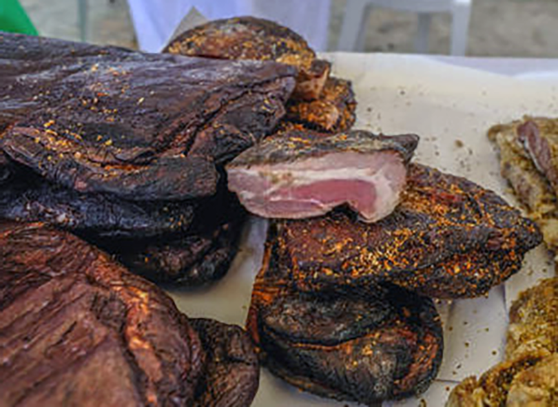 Cypriot chiromeri, cured and smoked ham in a shop window