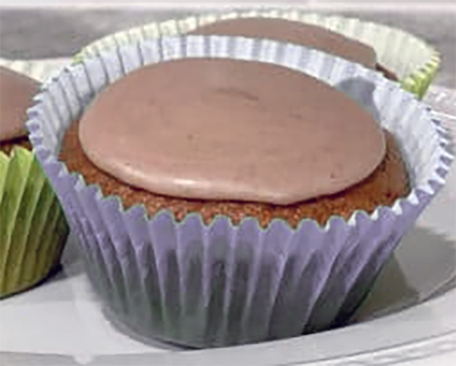 Coburg cupcake on a plate with cinnamon icing