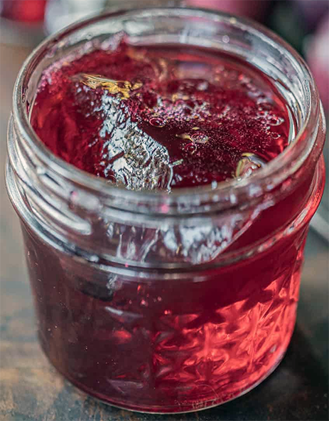 cornelian cherry and apple jelly in a jam jar