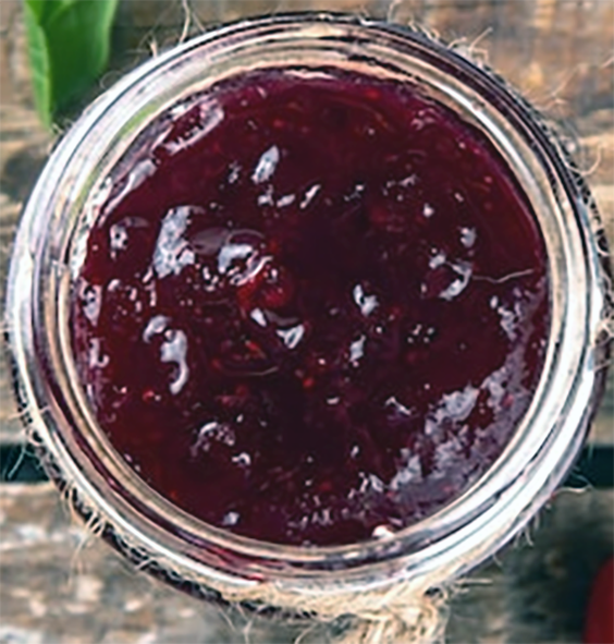 cornelian cherry marmalade in a glass jar viewed from above