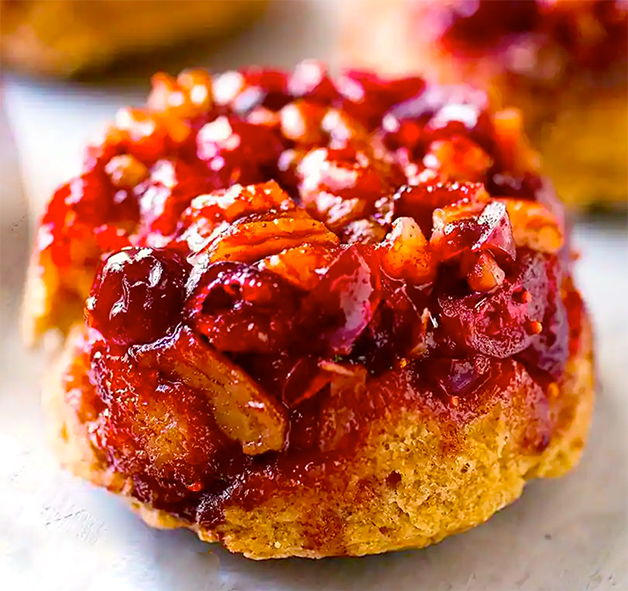 Cranberry-pecan Cinnamon Rolls on a white tablecloth