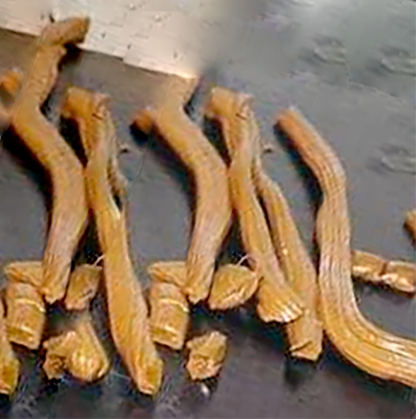 pulled lengths of Banwy toffee on a black work surface