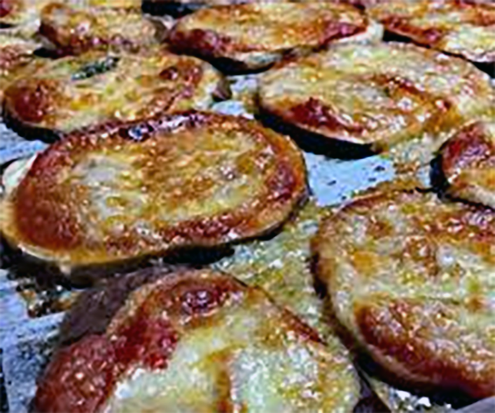 Patlijan, fried battered aubergines draining on kitchen paper