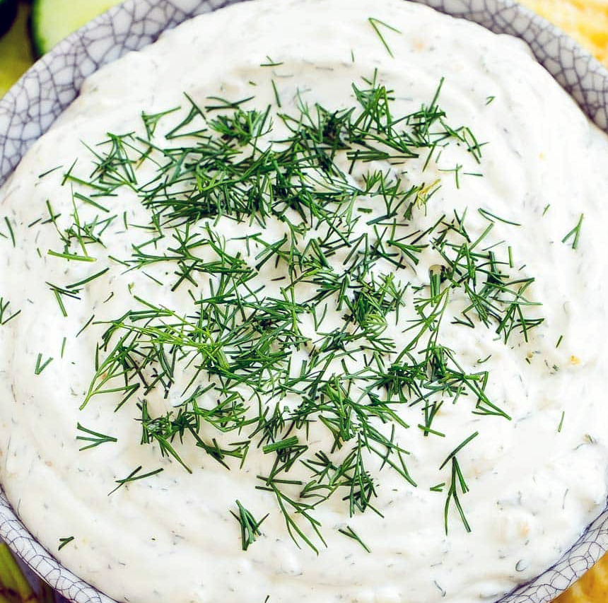 dill dip garnished with chopped dill in a bowl