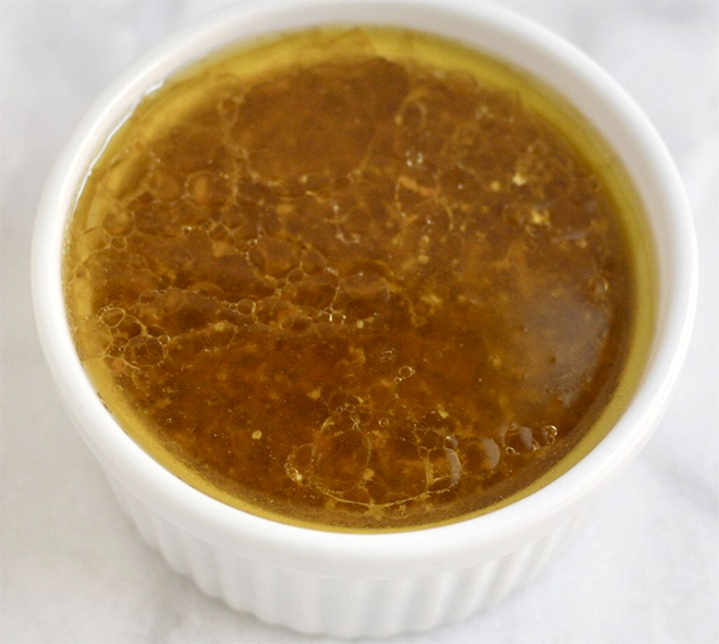 brown cold brawn sauce presented in a white ramekin
