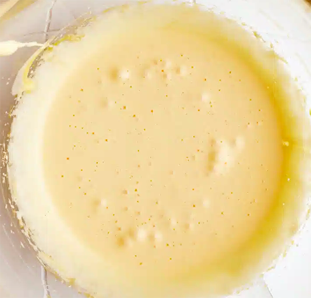 almond cream and egg yolk sauce whipped in a glass jug