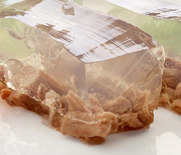 clear aspic jelly on a base of shredded meat