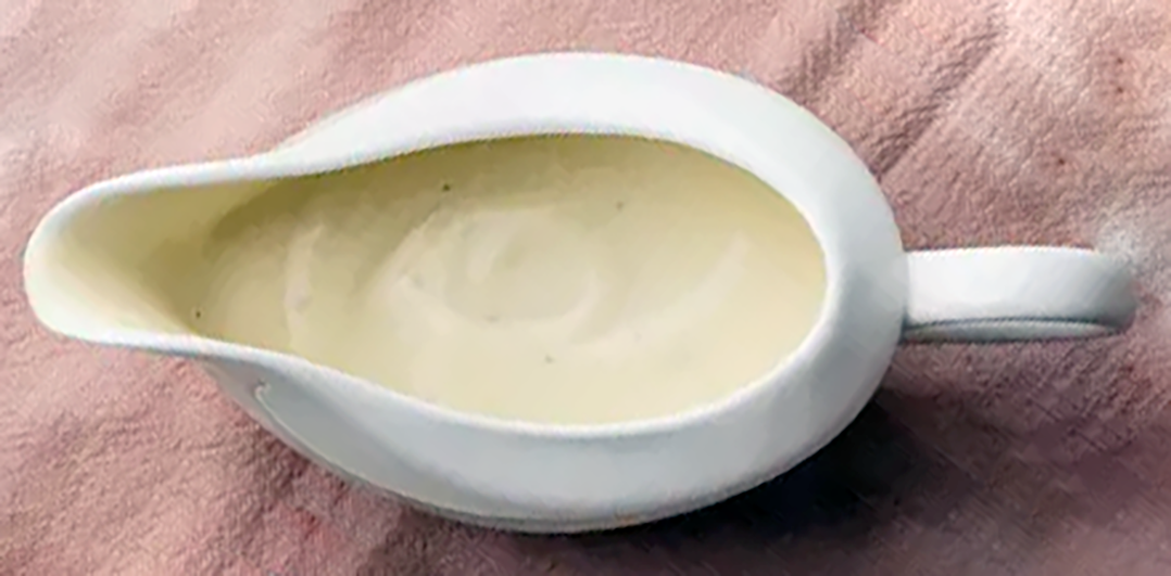 white sauce in a white sauce boat