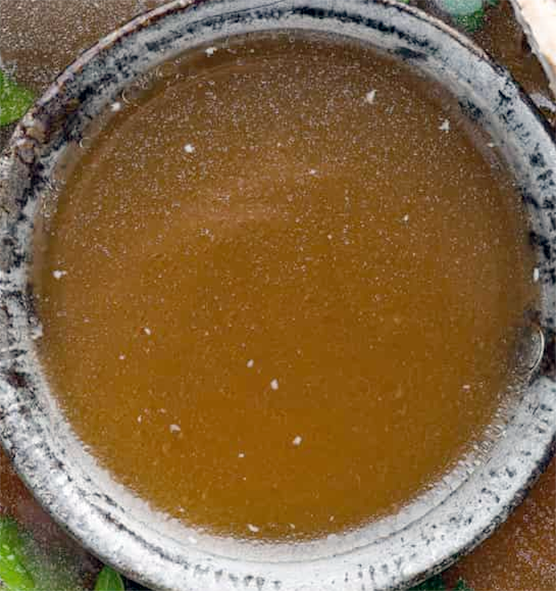 game stock in a metal ladle