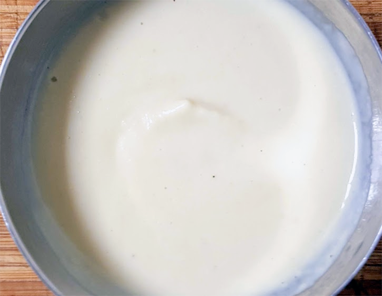 white soubise sauce in a dessert bowl