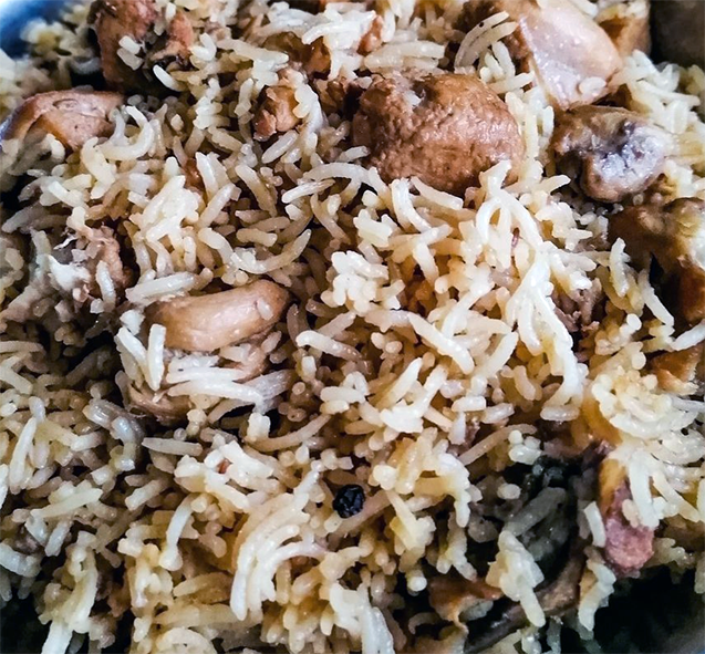 pilau of rice with chicken and ham in a balti dish