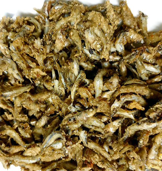 fried whitebait arranged on a plate